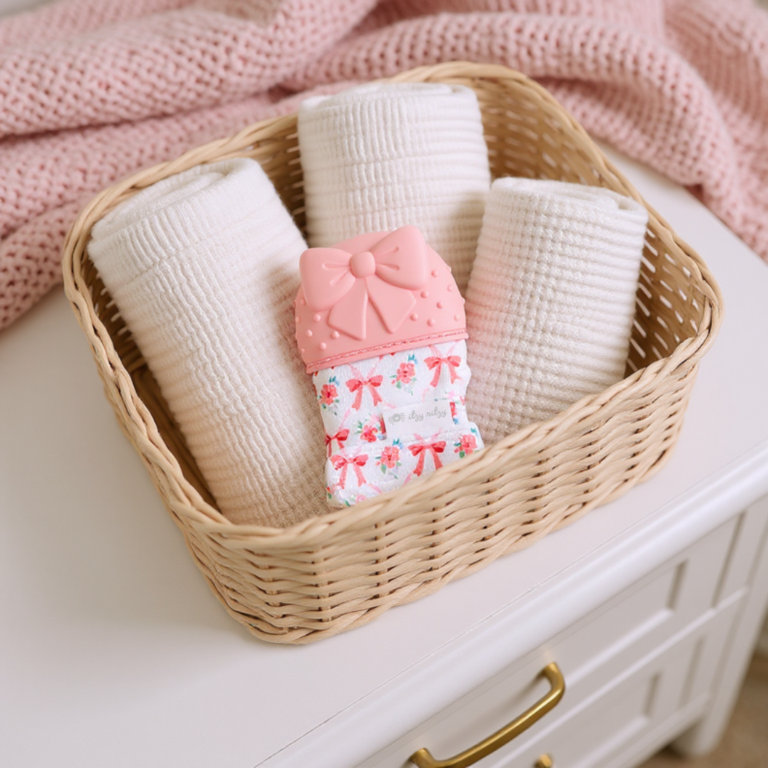 Itzy Mitt™ Silicone Bow Teething Mitt