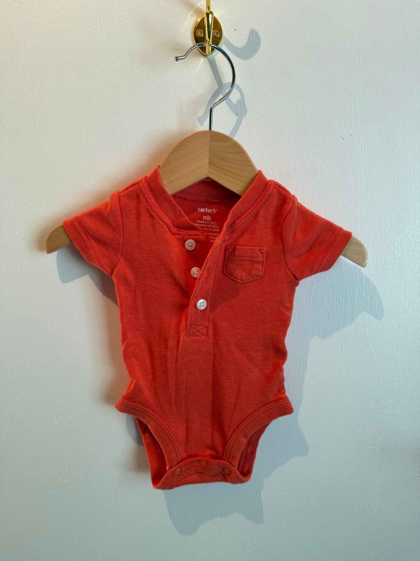 CARTERS ORANGE ONESIE NEWBORN