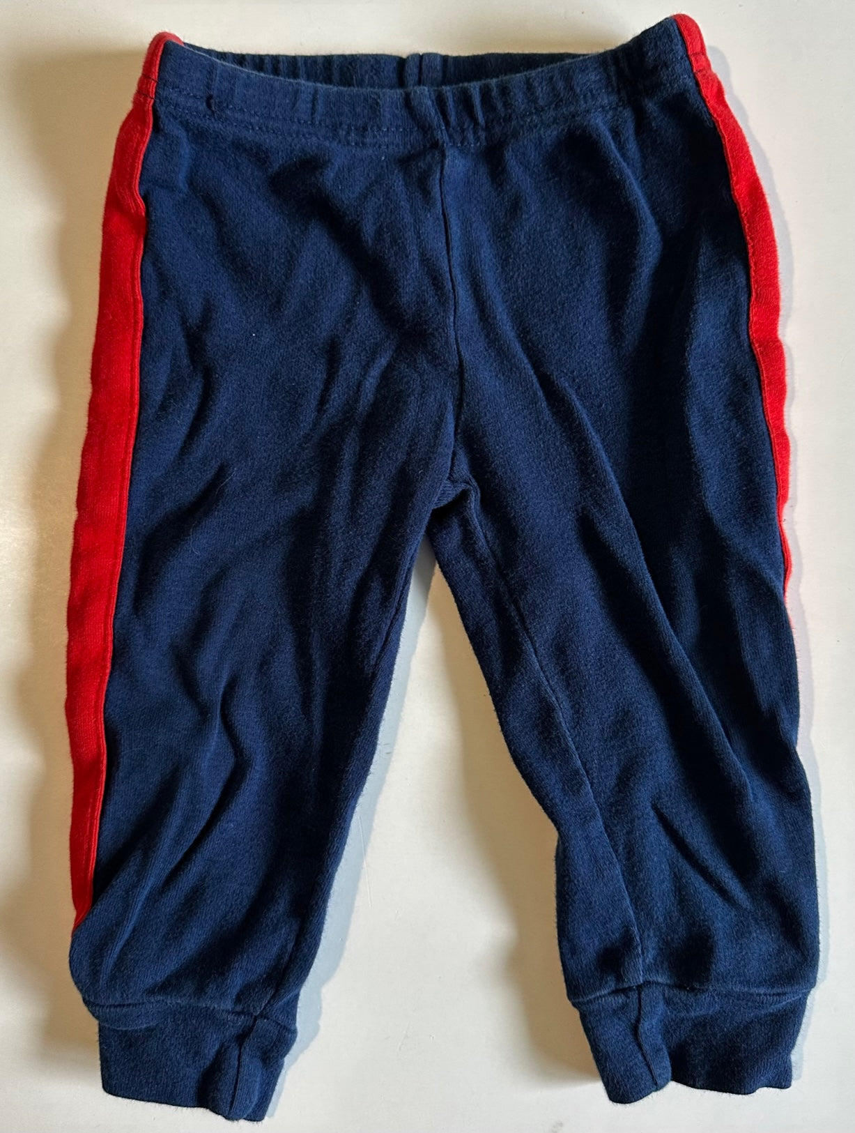 Pants with red deals side stripe